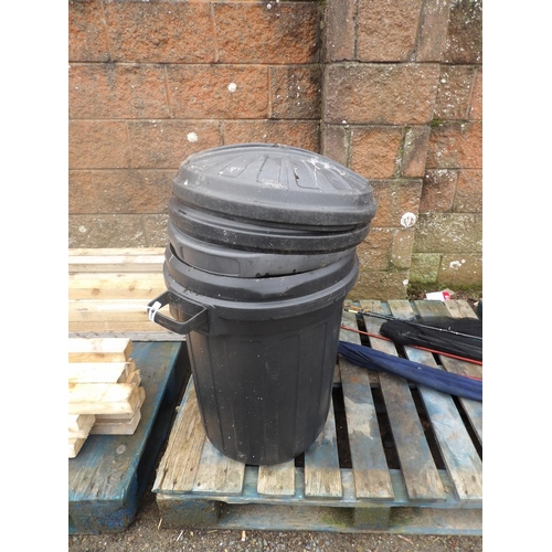 38 - Two black PVC dustbins complete with lids