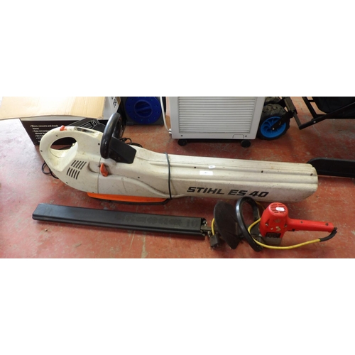 83 - A Stihl ES40 electric garden blower together with an electric hedge cutter