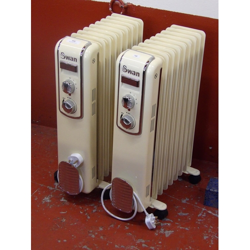 192 - Two Swan oil filled electric radiators modelled in the retro style