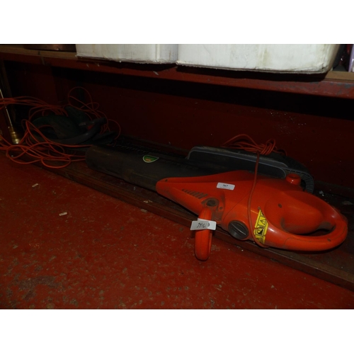 367 - Two electric hedge cutters together with a Flymo garden vac