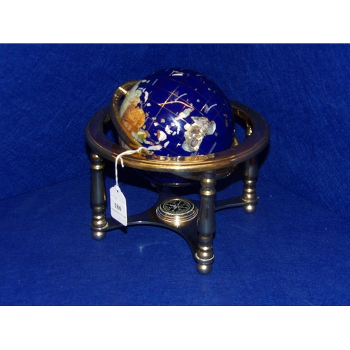 180 - A semi precious stone globe of the world mounted within a gilded gimbal stand