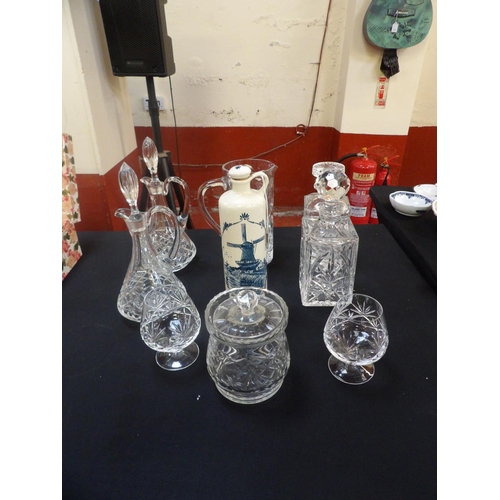 239 - Assorted crystal glass decanters and other glass ware, a Delft decanter etc.