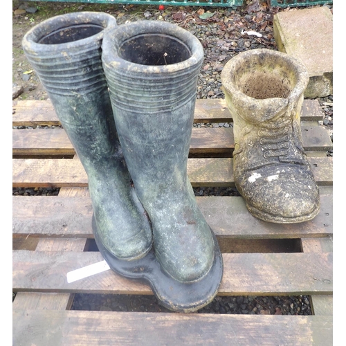 33 - A reconstituted stone model of a pair of wellington boots together with another of a boot