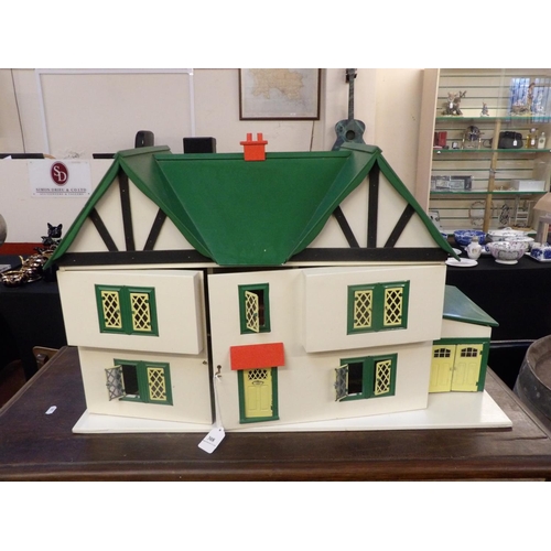 308 - A dolls house modelled in the Tudor style