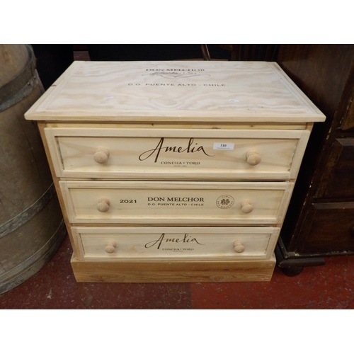 310 - A chest of three long drawers manufactured from wine crates