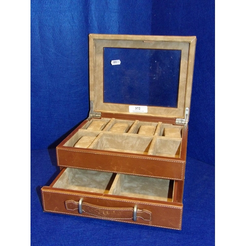 372 - A leather upholstered wrist watch and jewellery box