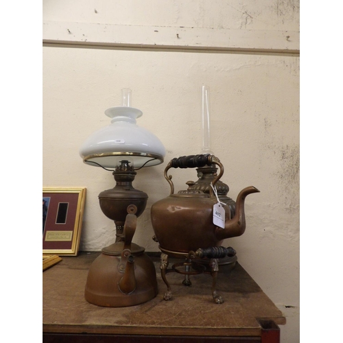 402 - Two vintage paraffin oil lamps together with a copper kettle and a spirit kettle