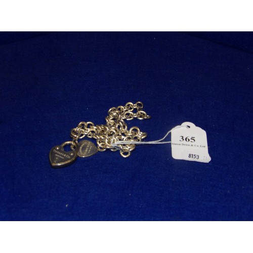 365 - A Tiffany of London chain link necklace with heart shaped pendant and heart shaped padlock