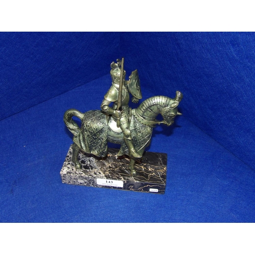 143 - A model of a medieval knight on horseback mounted upon a marble plinth