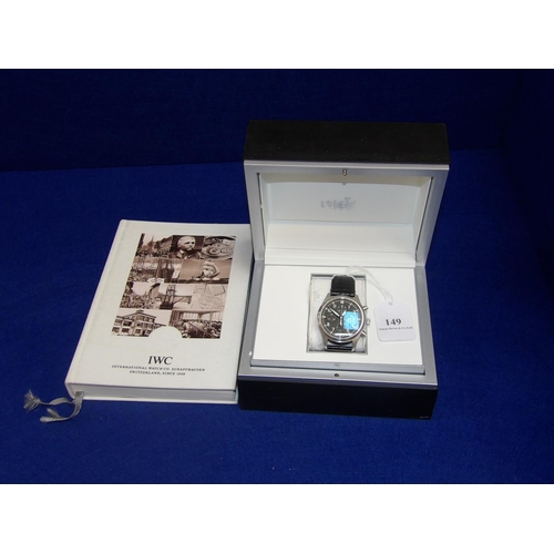 149 - An IWC pilot's watch chronograph wrist watch complete with case, documentation and accompanying book