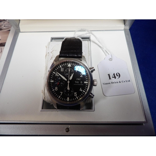 149 - An IWC pilot's watch chronograph wrist watch complete with case, documentation and accompanying book