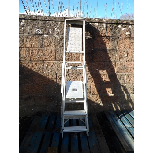 40 - An aluminium five tread step ladder together with an aluminium three tread step ladder