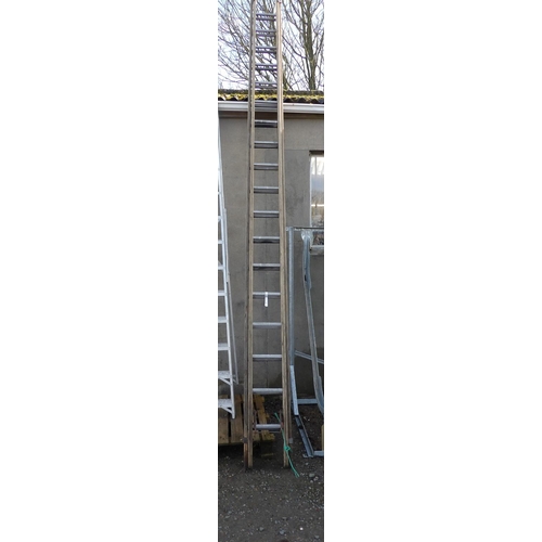 42 - A timber and aluminium rung eighteen tread extension ladder