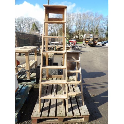 51 - A wooden seven tread step ladder together with a wooden five tread step ladder