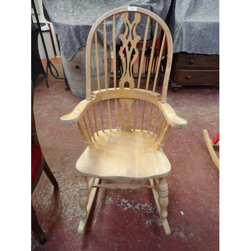 246 - A beech Windsor rocking chair