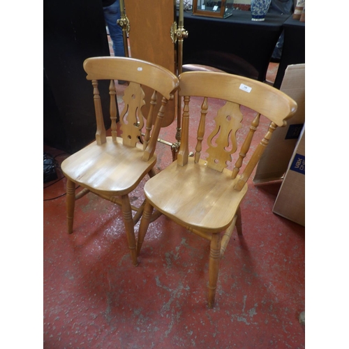 248 - A pair of beech kitchen chairs