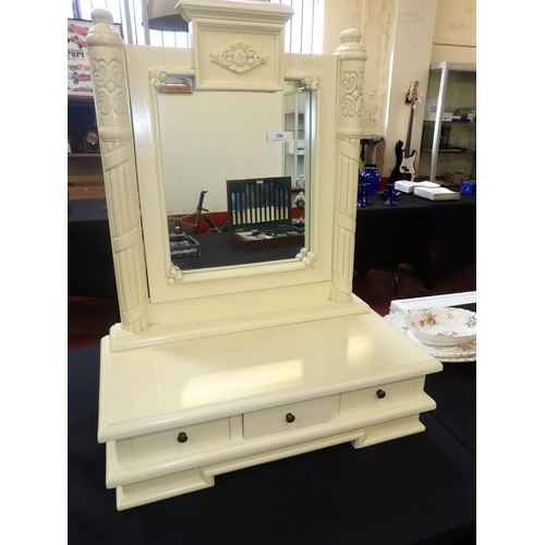 256 - A swivel mirror on box base fitted three short drawers