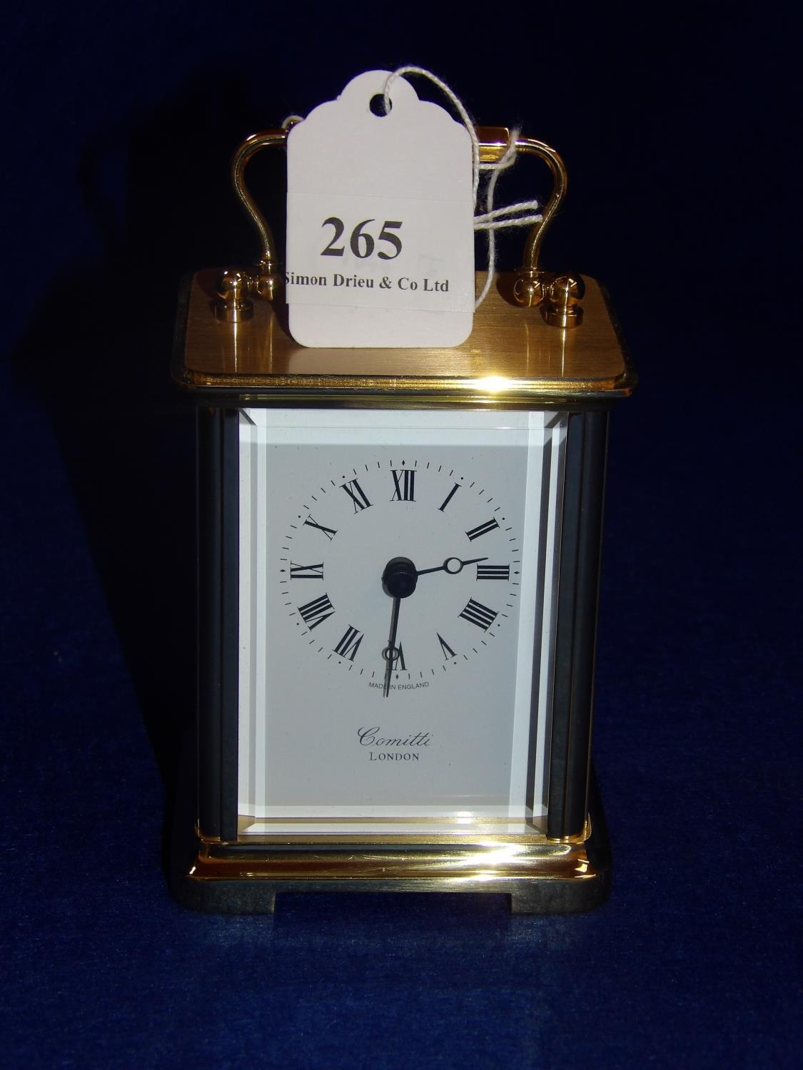 A gold tone carriage clock by Comitti of London