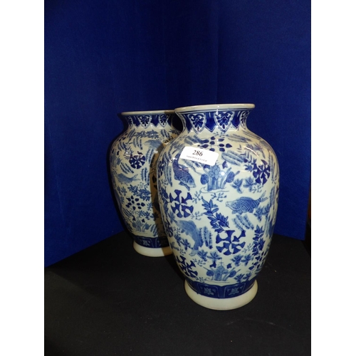 286 - Two blue and white oriental vases