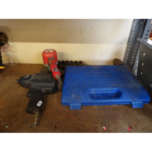 110 - A pneumatic orbital sander, a pneumatic impact wrench and sockets and a cased puller set