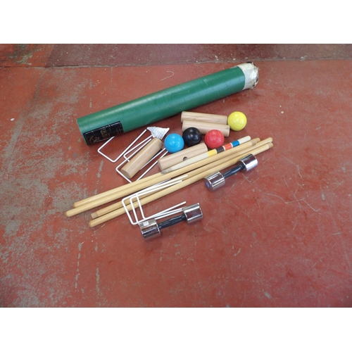130 - A Townsend garden croquet set together with two Salter dumbbells
