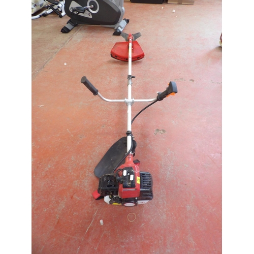 140 - A 43cc petrol pole strimmer with brush cutting attachment