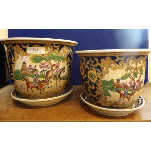 143 - Two salt glazed stone ware planters with pictorial decoration complete with saucers