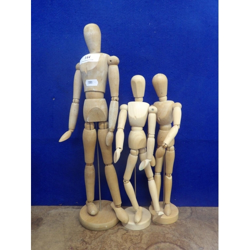 144 - A large wooden poseable artist's model together with two smaller ones