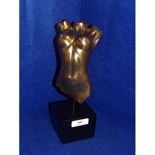 184 - A gilded model of the naked female form mounted upon an ebonised plinth