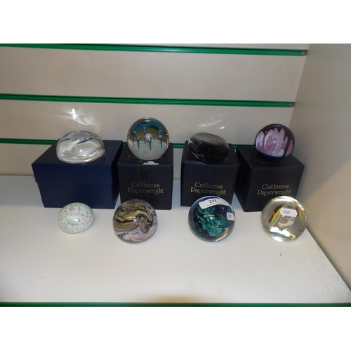 211 - A collection of Caithness and other glass paper weights