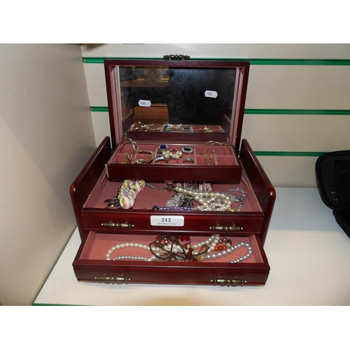 212 - A rosewood jewellery chest containing an accumulation of costume jewellery