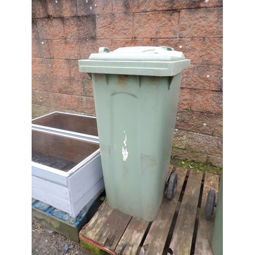 38 - A green PVC wheelie bin
