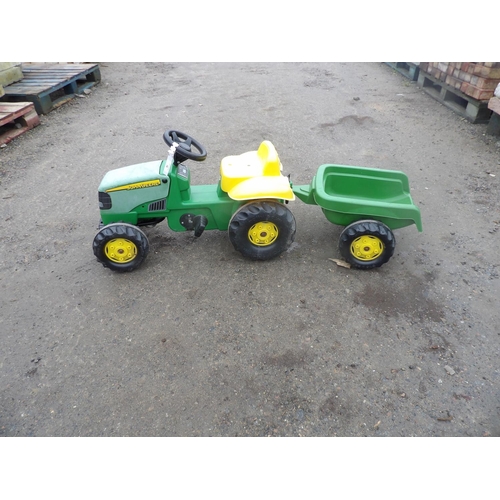 81 - A child's John Deere pedal tractor and trailer