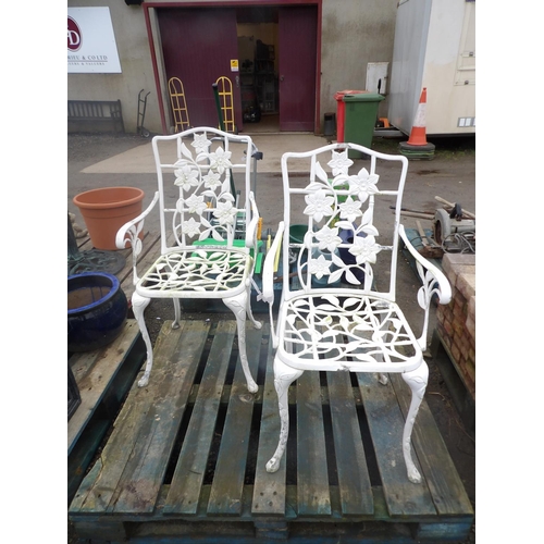 85 - A pair of pierced aluminium garden chairs