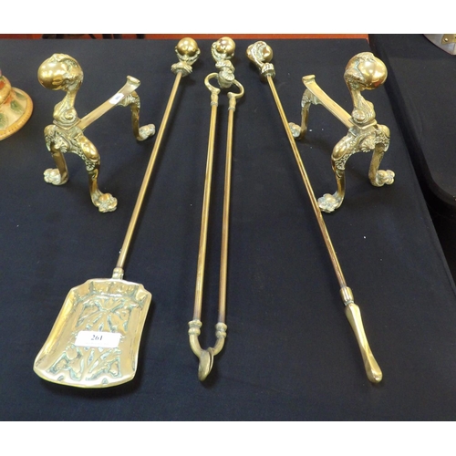 261 - A set of three brass fire irons complete with dogs