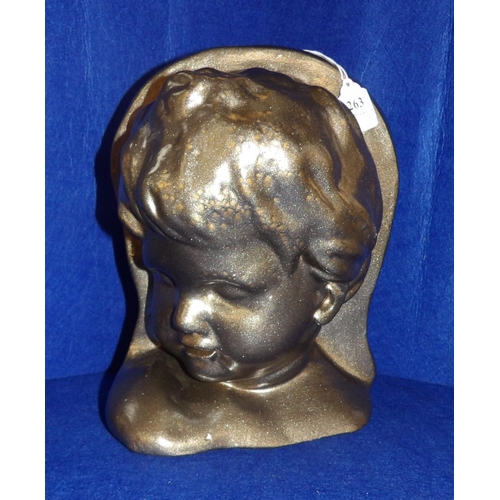 263 - A plaster wall sconce modelled as a child's head