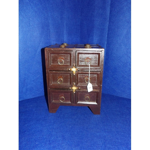 264 - An oriental flight of six spice drawers with applied metallic decoration