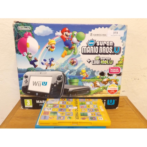 373 - A Nintendo Wii Mario & Luigi Premium Pack games console and games