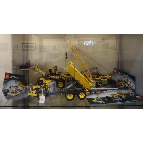 400 - A group of three Lego construction models; a payloader no. 8265, a tracked crane no. 7632 and an art... 