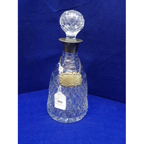 405 - A crystal decanter with silver mount and silver label