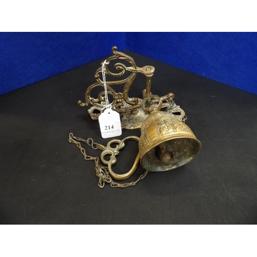 214 - A brass wall mounted bell on suspended linkage