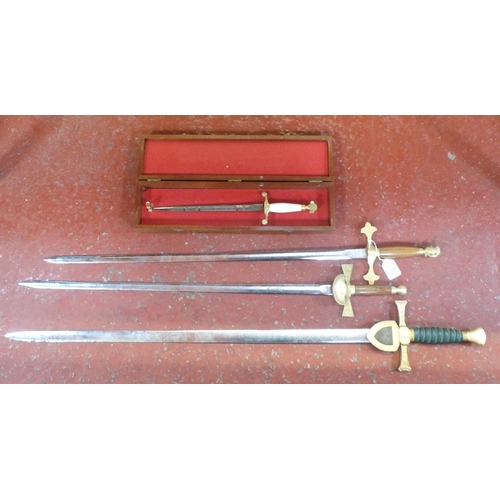 220 - A four piece 25th Anniversary of the Channel Islands Liberation 1945-1970 sword and dagger set