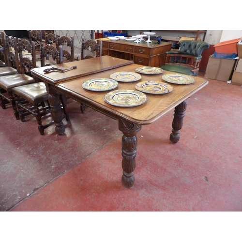 240 - A Victorian oak extending dining table