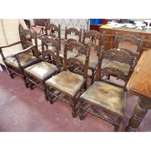 241 - A set of vintage oak dining chairs the seats upholstered in leather