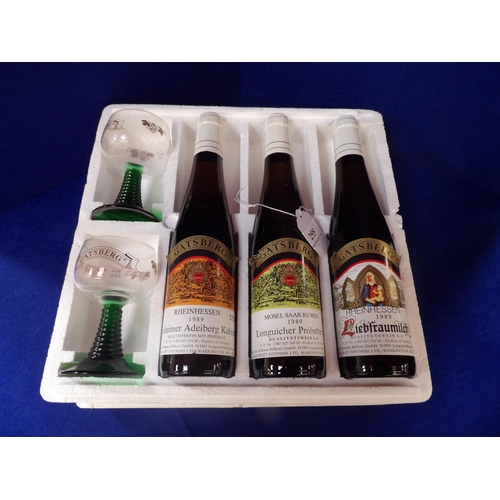 255 - A presentation set of three German white wines together with a pair of wine glasses by Gatsberg