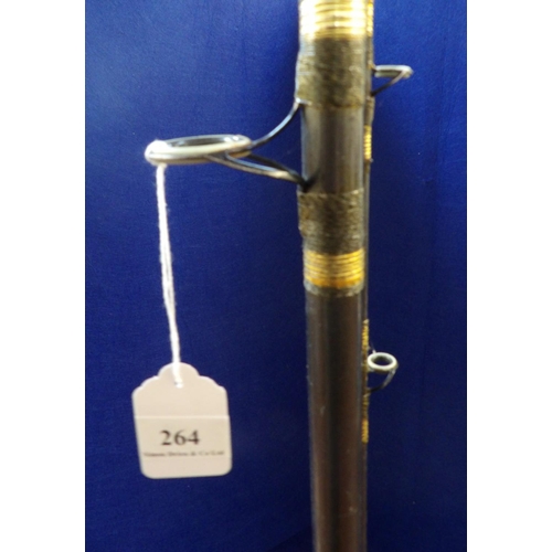 264 - A beachcaster fishing rod with Shakespeare fixed spool reel