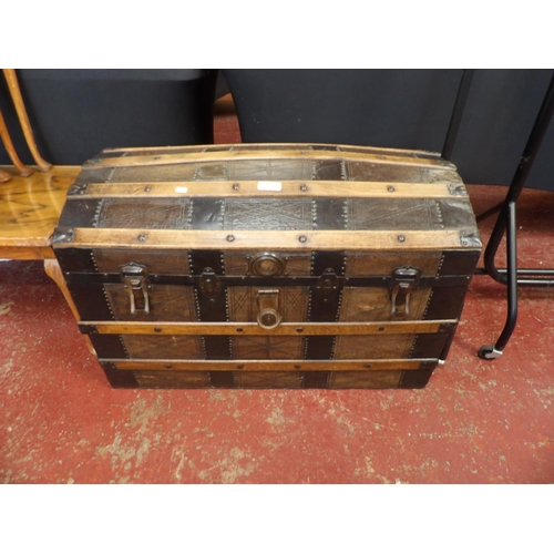 283 - A nineteenth century leather upholstered dome top trunk