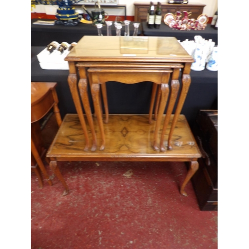 284 - A graduated nest of three mahogany occasional tables together with a matching rectangular coffee tab... 