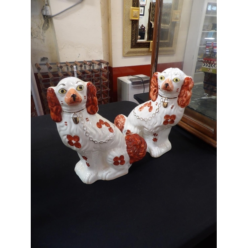 297 - A pair of Staffordshire Victorian style mantle dogs by Messrs. Arthur Wood