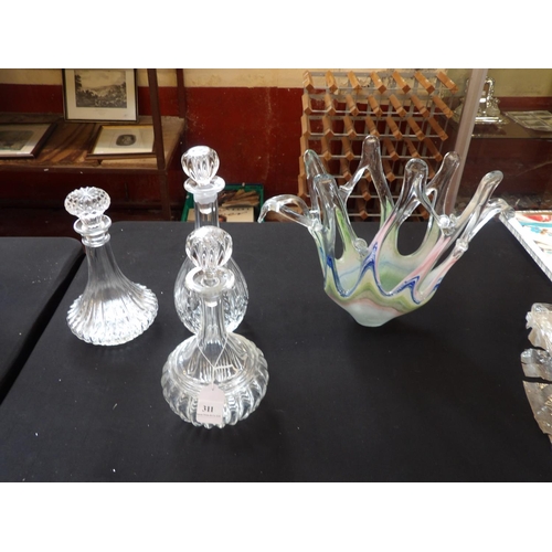 311 - Three glass decanters together with an art glass centre piece